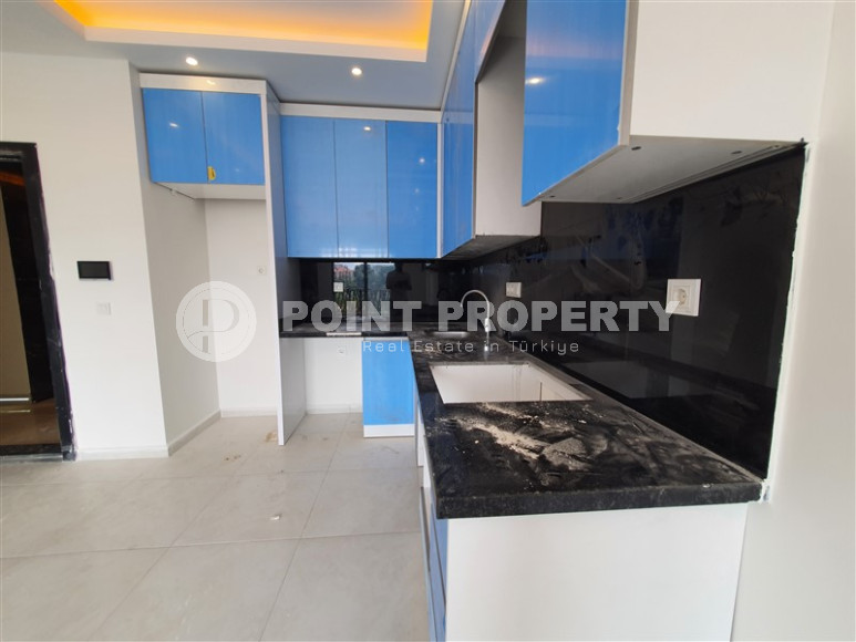 Two-room apartment with mountain views in a new complex in Mahmutlar-id-1211-photo-15