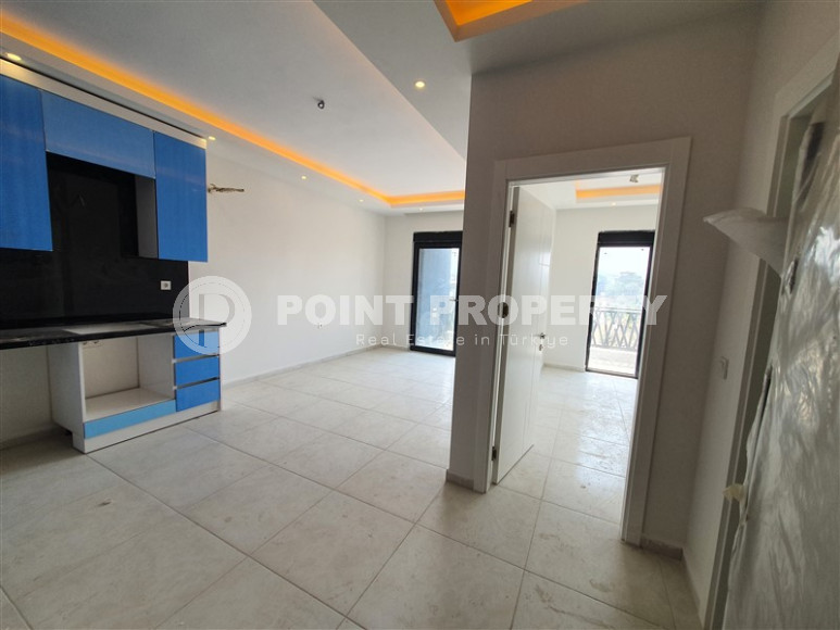 Two-room apartment with mountain views in a new complex in Mahmutlar-id-1211-photo-16