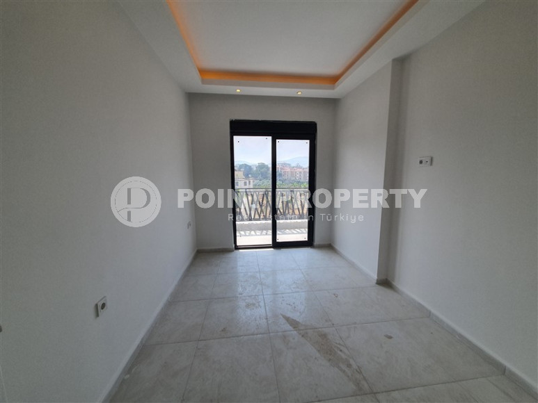 Two-room apartment with mountain views in a new complex in Mahmutlar-id-1211-photo-18