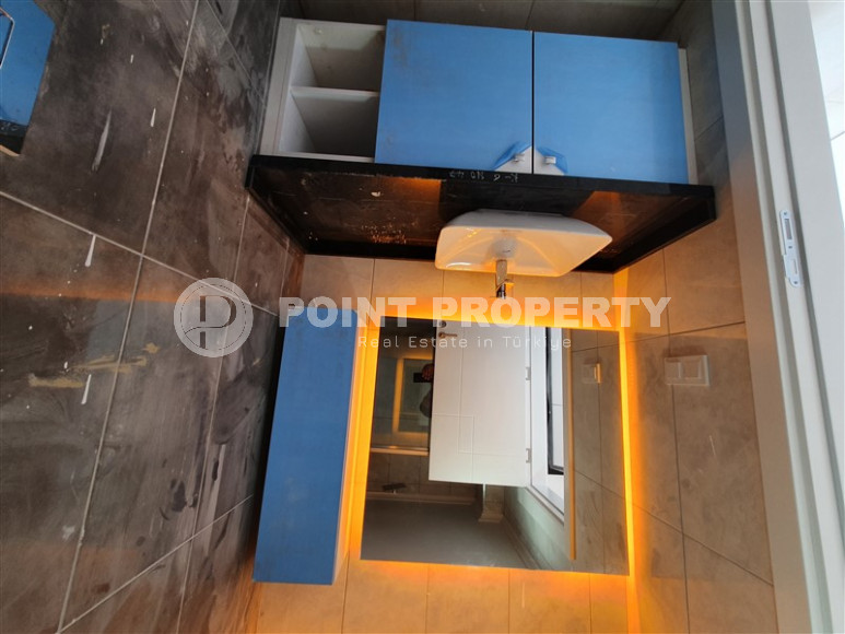 Two-room apartment with mountain views in a new complex in Mahmutlar-id-1211-photo-19