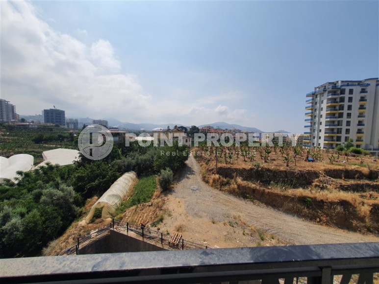 Two-room apartment with mountain views in a new complex in Mahmutlar-id-1211-photo-22