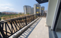 Two-room apartment with mountain views in a new complex in Mahmutlar-id-1211-photo-23