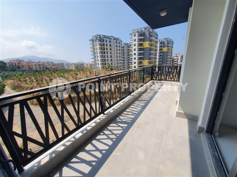 Two-room apartment with mountain views in a new complex in Mahmutlar-id-1211-photo-23