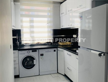 Three-room apartment with a separate kitchen in the popular area of Mahmutlar.-id-1216-photo-2