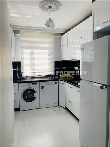 Three-room apartment with a separate kitchen in the popular area of Mahmutlar.-id-1216-photo-2