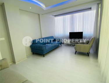 Three-room apartment with a separate kitchen in the popular area of Mahmutlar.-id-1216-photo-5