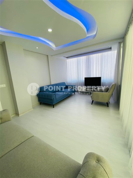 Three-room apartment with a separate kitchen in the popular area of Mahmutlar.-id-1216-photo-5