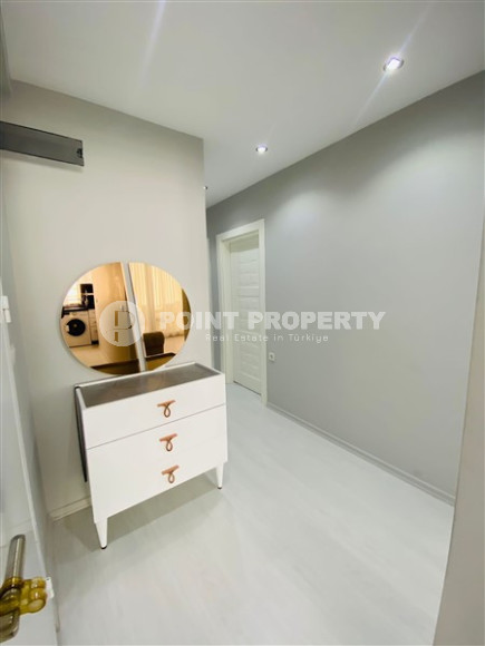 Three-room apartment with a separate kitchen in the popular area of Mahmutlar.-id-1216-photo-11