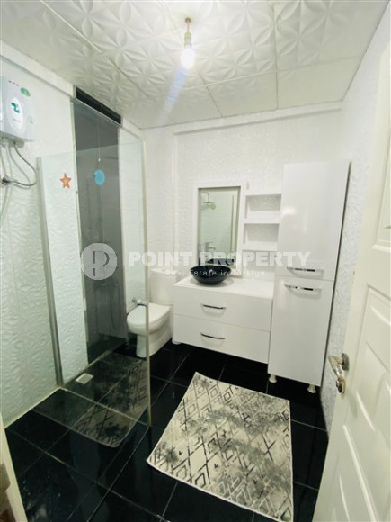 Three-room apartment with a separate kitchen in the popular area of Mahmutlar.-id-1216-photo-13