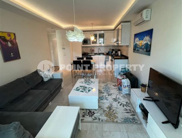 Elegant one-bedroom apartment, 86m², in a premium complex in Oba, Alanya.-id-2551-photo-2