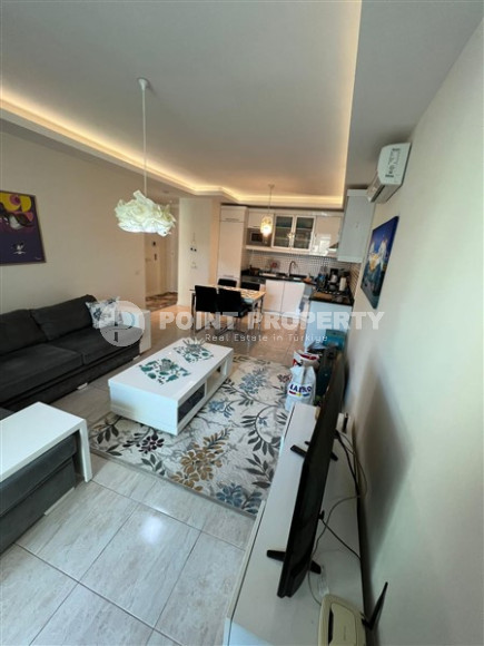 Elegant one-bedroom apartment, 86m², in a premium complex in Oba, Alanya.-id-2551-photo-3