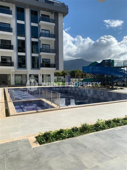 Квартира 1+1, 50м², с чистовой отделкой в новом комплексе премиум класса в районе Верхняя Оба, Алания.-id-2570-фото-2