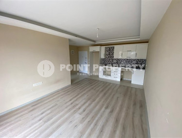 Двухкомнатная квартира, 55м², в современной резиденции с бассейном в Окурджаллар, Алания-id-2418-фото-2