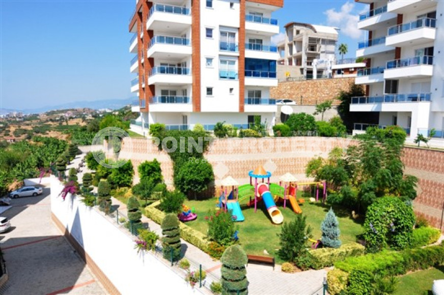 Уютная квартира с двумя спальнями, 112м², в грандиозной элитной резиденции района Каргыджак, Алания.-id-2616-фото-2