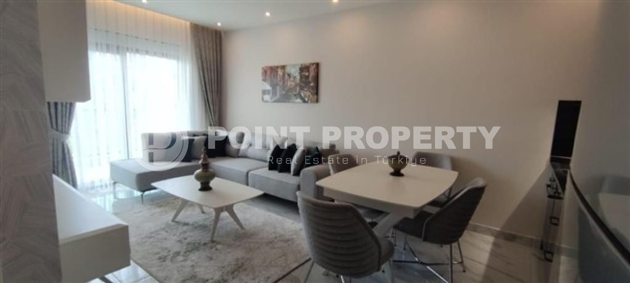 Двухкомнатная квартира, 45м², с пакетом мебели. в новой резиденции с инфраструктурой в Оба, Алания-id-2630-фото-2