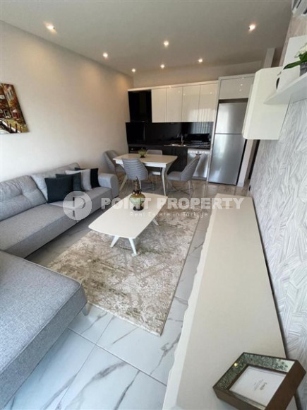 Двухкомнатная квартира, 45м², с пакетом мебели. в новой резиденции с инфраструктурой в Оба, Алания-id-2630-фото-3