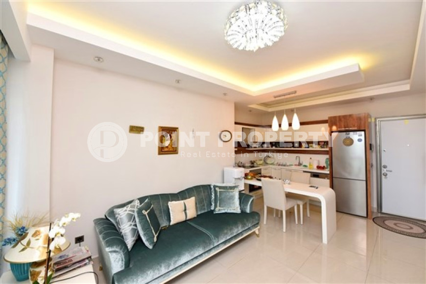 Stylish and compact 1+1 apartment with glazed balcony, 70 m2 in Mahmutlar, Alanya-id-2673-photo-2