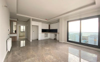 View apartment 2+1 in a new building, unfurnished, 120 m2, in the Mezitli area, Mersin-id-2682-photo-3