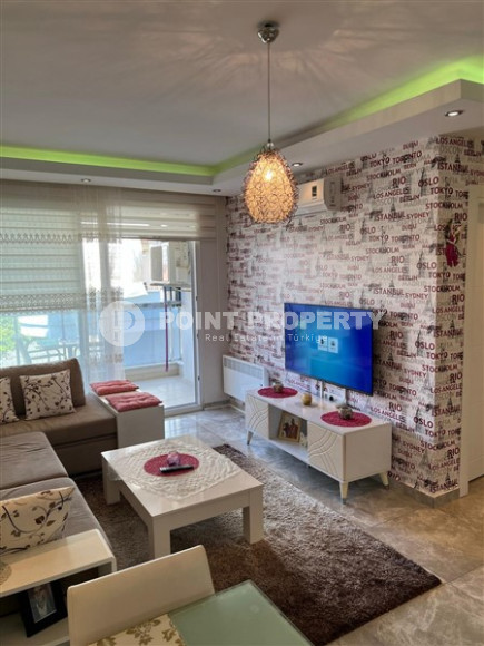 Well-maintained apartment 65 m2, 1+1, in a five-story building built in 2012 in the Oba area, Alanya-id-2686-photo-3