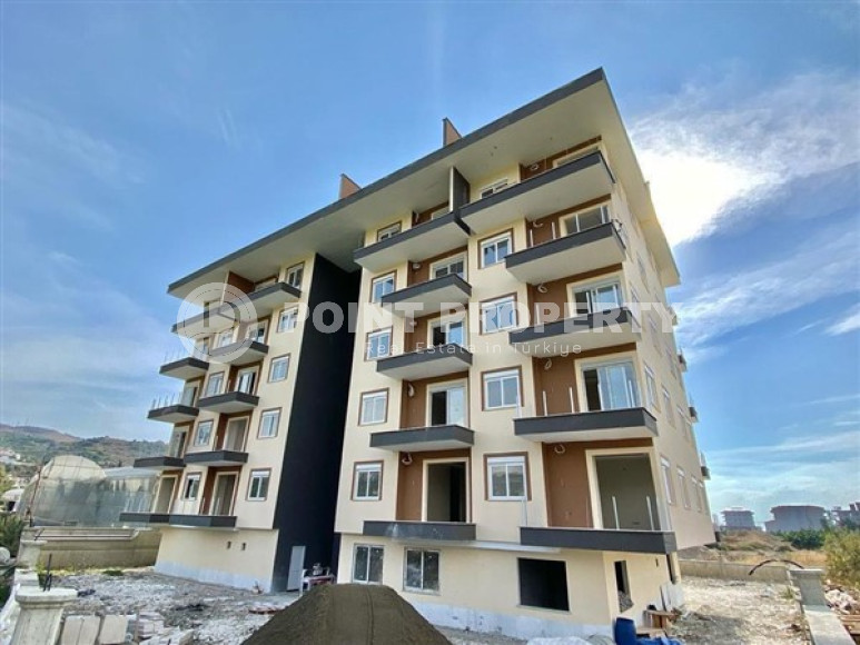 Двухкомнатная квартира, 65м², в новом комплексе в 1100м от моря в Каргыджаке, Алания-id-2725-фото-2