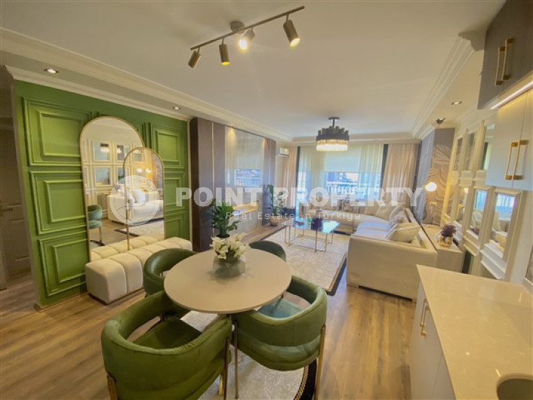 Фешенебельная двухкомнатная квартира, 65м², в 400м от моря в районе Алании Тосмур-id-2728-фото-2