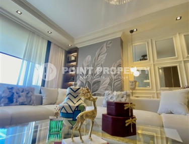 Фешенебельная двухкомнатная квартира, 65м², в 400м от моря в районе Алании Тосмур-id-2728-фото-3