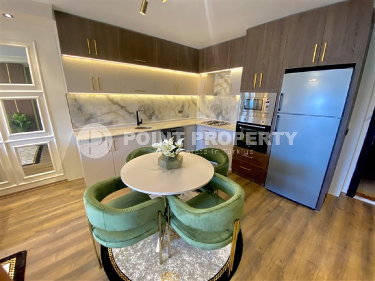 Фешенебельная двухкомнатная квартира, 65м², в 400м от моря в районе Алании Тосмур-id-2728-фото-6