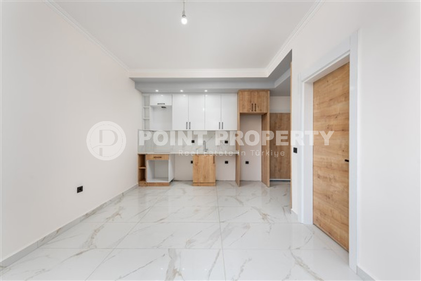 Двухкомнатная квартира, 50м², с чистовой отделкой в новом комплексе в районе Авсаллар, Алания-id-2738-фото-2