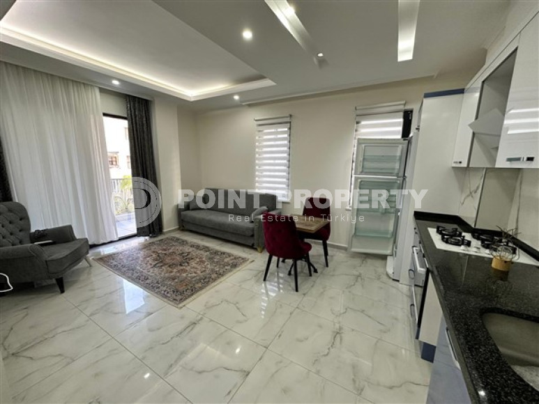 Новая меблированная квартира с одной спальней, 65м². в комплексе с инфраструктурой в районе Махмутлар, Алания-id-2754-фото-2