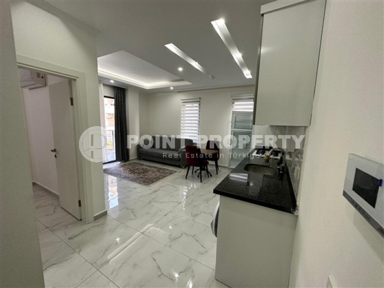 Новая меблированная квартира с одной спальней, 65м². в комплексе с инфраструктурой в районе Махмутлар, Алания-id-2754-фото-4