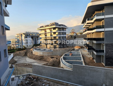 One-bedroom apartment under construction 550 m from the sea, 61 m², in Kargicak area, Alanya-id-2811-photo-2
