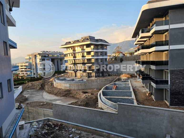 One-bedroom apartment under construction 550 m from the sea, 61 m², in Kargicak area, Alanya-id-2811-photo-2