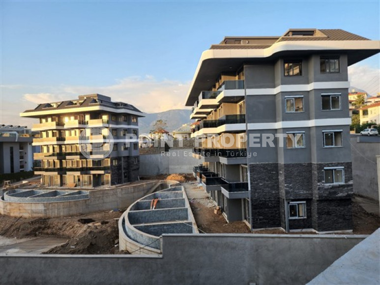 One-bedroom apartment under construction 550 m from the sea, 61 m², in Kargicak area, Alanya-id-2811-photo-3