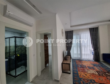 Stylish, two-room apartment with 1+1 layout, 75m2 in Alanya, in the popular Mahmutlar area.-id-1250-photo-2