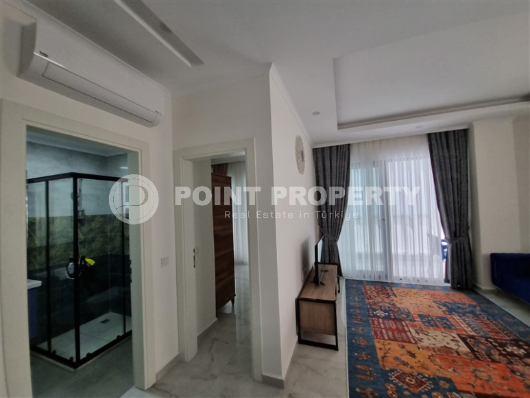 Stylish, two-room apartment with 1+1 layout, 75m2 in Alanya, in the popular Mahmutlar area.-id-1250-photo-2