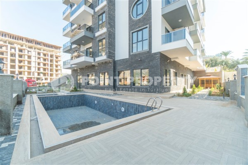 Inexpensive two-room apartment with an area of 55m2, in the Mahmutlar area, with a balcony and unfurnished-id-2837-photo-4