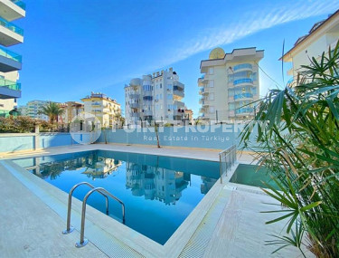 Стандартная по площади квартира 1+1 в районе Оба, в новом комплексе 2022 года-id-2877-фото-1