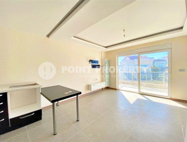 Стандартная по площади квартира 1+1 в районе Оба, в новом комплексе 2022 года-id-2877-фото-3