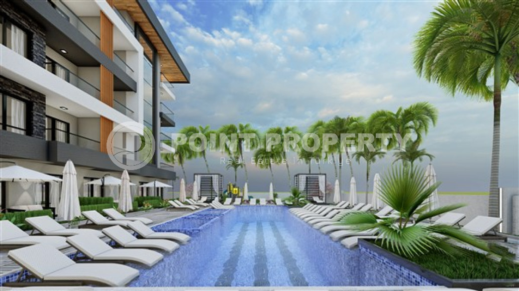 Недорогая квартира небольшой площадью 45 м2 в строящемся комплексе (июнь 2023 года) в районе Оба, Аланья-id-2890-фото-3