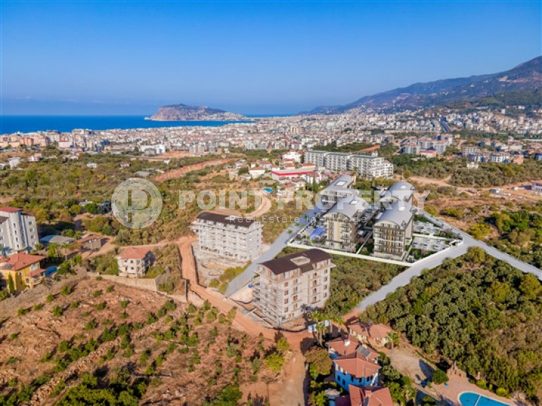 Недорогая квартира небольшой площадью 45 м2 в строящемся комплексе (июнь 2023 года) в районе Оба, Аланья-id-2890-фото-10