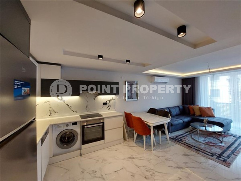 Современная двухкомнатная квартира 65 м2, центр Аланьи, в строящемся комплексе с роскошной отельной инфраструктурой-id-2944-фото-11