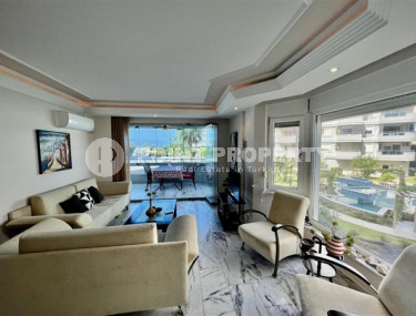 Apartment 3+1 by the sea, with a large living room and balconies with frameless glazing, Tosmur, Alanya-id-3064-photo-1