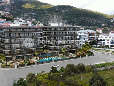 Двухкомнатные апартаменты 45 м2 в роскошном строящемся комплексе в центре Аланьи, Хасбахче-id-3073-фото-2