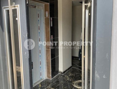 Inexpensive apartment 70 m2 with two rooms in a house built in 2022, Gazipasa-id-3074-photo-2