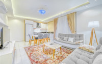 Lovely 2+1 apartment in white and gold tones, on the second line from the sea, Mahmutlar, Alanya-id-3145-photo-1