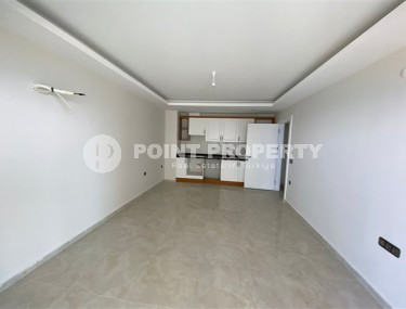 View apartment 2+1 in a house on the first coastline, Mahmutlar, Alanya-id-3206-photo-2