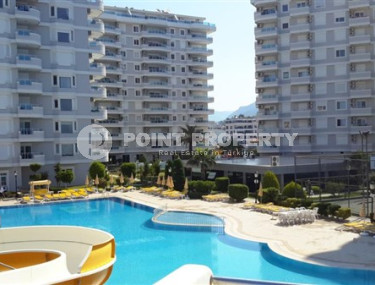 Apartment with an area of 120 m2 in the Tosmur area, Alanya, with a convenient location on the first sea line-id-3212-photo-1
