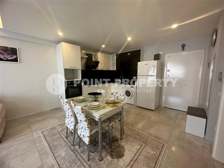 Классические апартаменты 1+1 в высотном здании района Махмутлар, Аланья-id-3217-фото-17