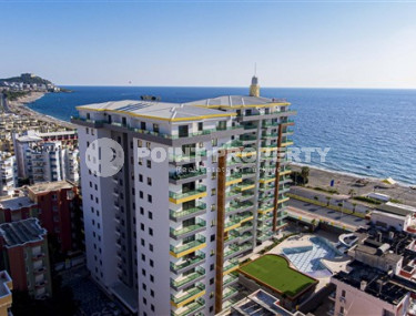 Stylish two-bedroom apartment in a residential complex on the first line, Mahmutlar, Alanya-id-3245-photo-1