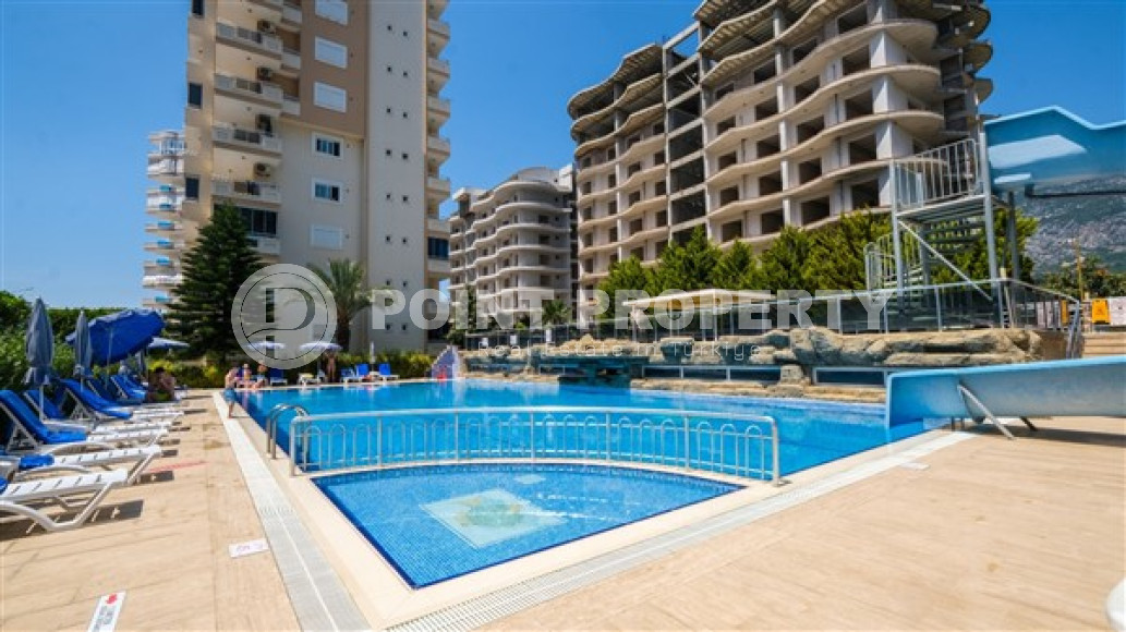 Luxurious three-room apartment 100 m2 in Mahmutlar area, Alanya, with swimming pools and water park-id-3307-photo-12